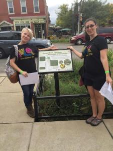 Proud 15th Ward/Tower Grove South residents Alderwoman Megan Green - on the right - and Lisa Cagle pose with a guided walking tour sign on South Grand Blvd.