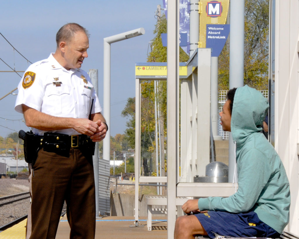 Captain Scott Melies speaks with MetroLink rider on the system. 